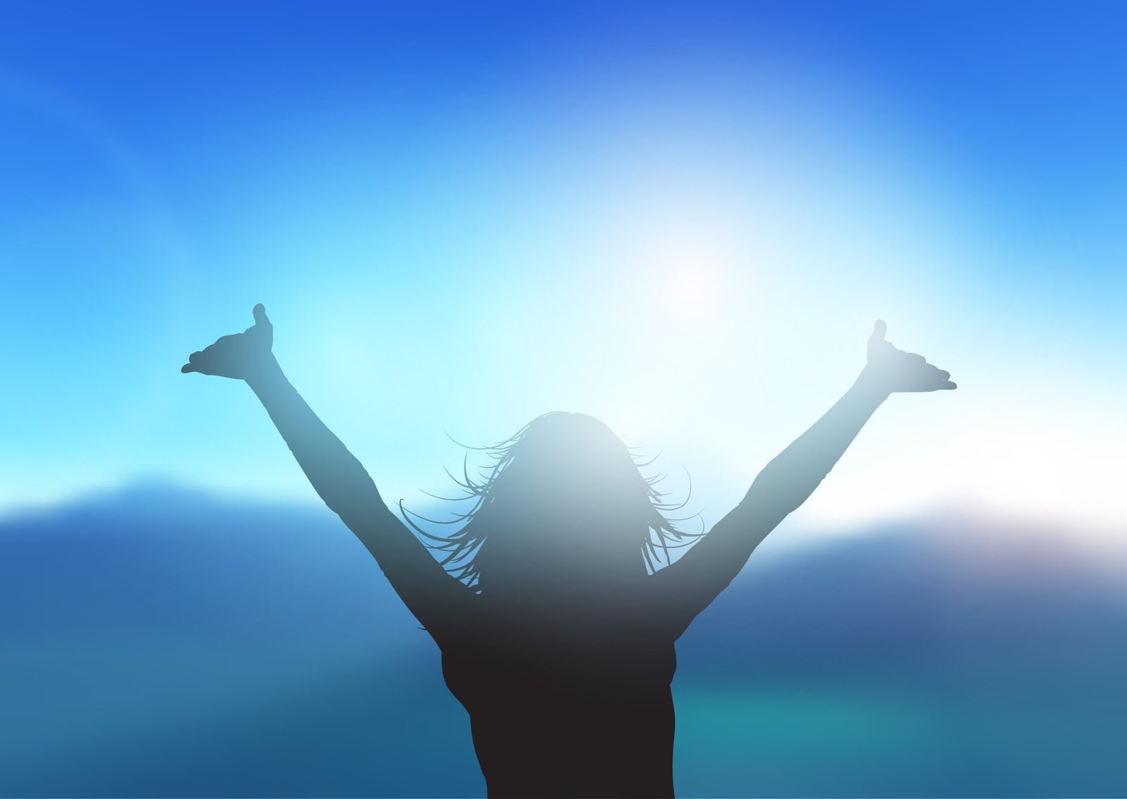 Woman raising her arms towards a bright sky